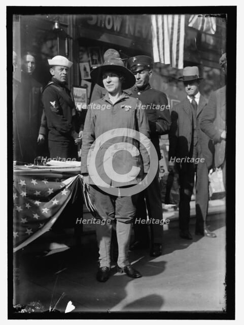 Dora Rodrigues, recruiter for service branches, possibly in front of the Cosmos Theater..., May 1917 Creator: Harris & Ewing.
