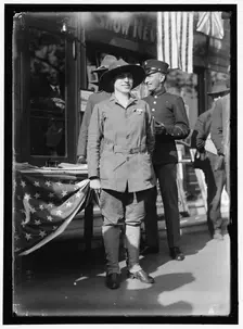 Dora Rodrigues, recruiter for service branches, possibly in front of the Cosmos Theater..., May 1917 Creator: Harris & Ewing