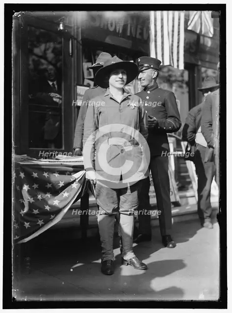 Dora Rodrigues, recruiter for service branches, possibly in front of the Cosmos Theater..., May 1917 Creator: Harris & Ewing.