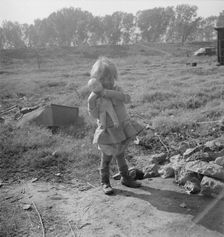 Daughter of a migrant fruit worker, American River camp outside of Sacramento, California, 1936. Creator: Dorothea Lange