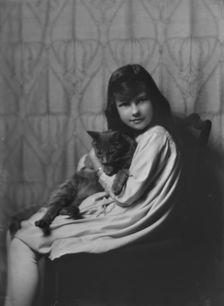 Daughter of Mrs. H Gamble, with cat, portrait photograph, 1917 Nov. 23. Creator: Arnold Genthe