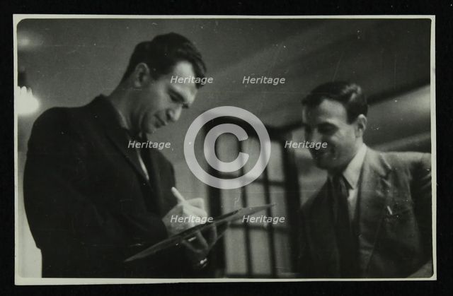 Dave Brubeck signing an autograph, c1950s. Creator: Denis Williams.