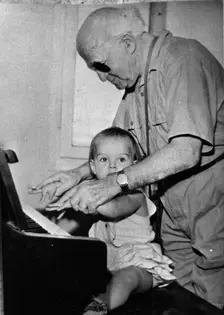 David Ben Gurion (1886-1973) trying to teach piano to his little granddaughter. Creator: Unknown