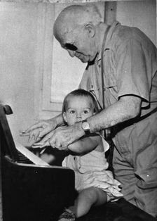David Ben Gurion (1886-1973) trying to teach piano to his little granddaughter