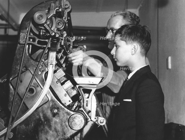 David Reiss inspects a linotype machine at the "Jewish Chronicle", London, 1960. Creator: EH Emanuel.