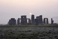 Dawn at Stonehenge, Wiltshire, c20th century. Artist: CM Dixon