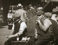 Day labourers having a hot dog and lemonade, Battery Park, New York, USA, early 1930s. Creator: Unknown