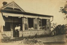 Dacha Seyuza, with the Pray family and servants posed on the front porch..., between 1907 and 1909. Creator: Eleanor Lord Pray