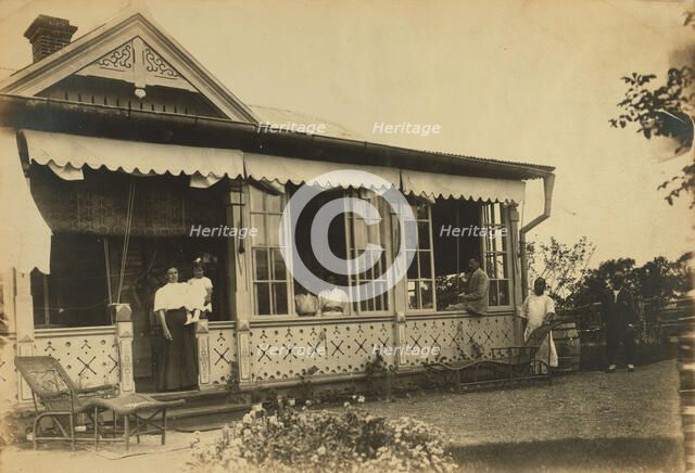 Dacha Seyuza, with the Pray family and servants posed on the front porch..., between 1907 and 1909. Creator: Eleanor Lord Pray.