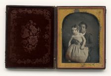 Daguerreotype of a boy holding a white baby, 1850s. Creator: Unknown