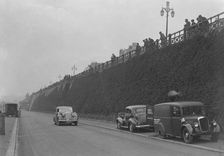 Daimler of CM Simpson and a Morris loudspeaker van on Madeira Drive, Brighton, RAC Rally, 1939. Artist: Bill Brunell