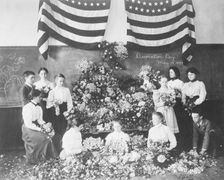 Daisies gathered for Decoration Day, May 30, 1899, (1899?). Creator: Frances Benjamin Johnston