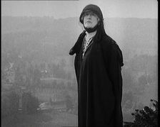 Dame Ellen Terry Standing on a Hill Looking at the View, 1920s. Creator: British Pathe Ltd