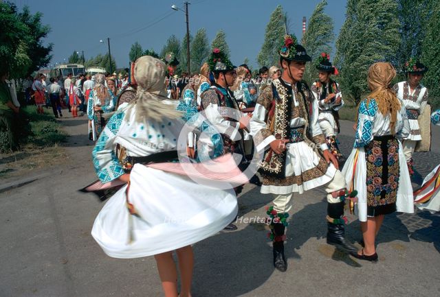 Dancers at a Hungarian folklore festival. Artist: CM Dixon Artist: Unknown