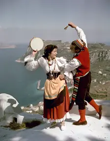 Dancers perform a tarantella above the Bay of Naples, Isle of Capri, Italy, 1948. Creator: Göran Algård