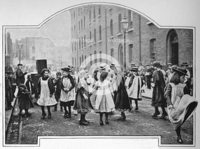 Dancing to a street organ, London, c1901 (1901). Artist: Unknown.