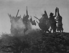 Dancing to restore an eclipsed moon, c1914. Creator: Edward Sheriff Curtis