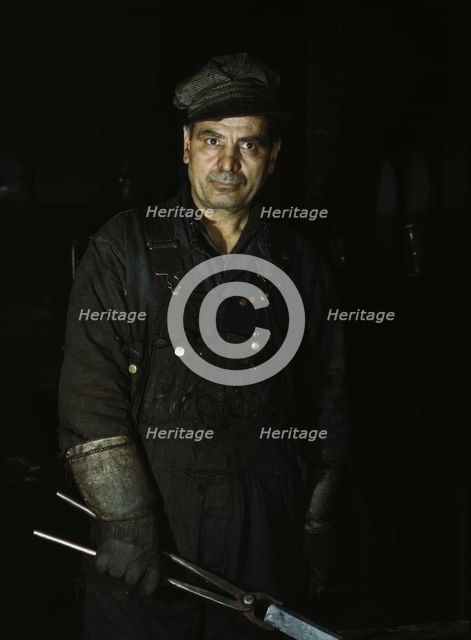 Daniel Anastazia, blacksmith's helper, Rock Island R.R., Blue Island, Ill., 1943. Creator: Jack Delano.
