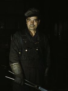 Daniel Anastazia, blacksmith's helper...roundhouse of the Rock Island R.R., Blue Island, Ill., 1943. Creator: Jack Delano