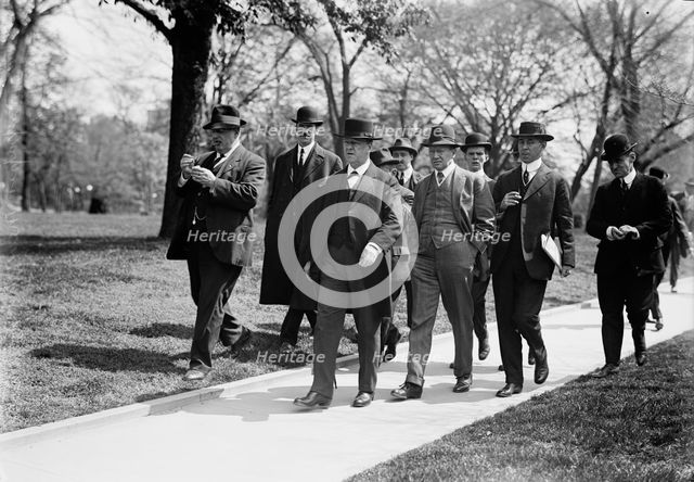 Daniels, Josephus, Secretary of The Navy, 1913-1921. with Newsmen, 1914. Creator: Harris & Ewing.