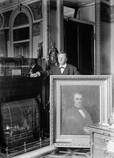 Daniels, Josephus, Secretary of The Navy, 1913-1921. with Painting of Secretary of The Navy..., 1913 Creator: Harris & Ewing