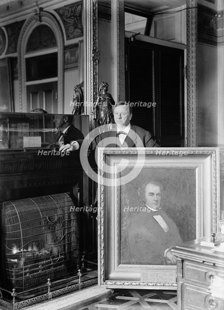 Daniels, Josephus, Secretary of The Navy, 1913-1921. with Painting of Secretary of The Navy..., 1913 Creator: Harris & Ewing.