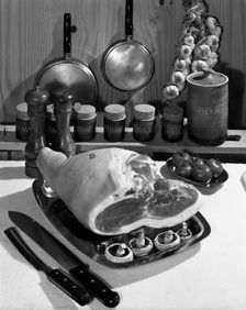 Danish Bacon gammon joint with spice jars, 1963. Creator: Michael Walters