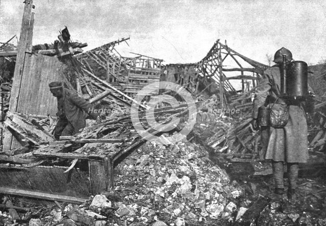 'Dans Cantigny; un des derniers Allemands trouves dans les caves du village se degage..., 1918. Creator: Unknown.