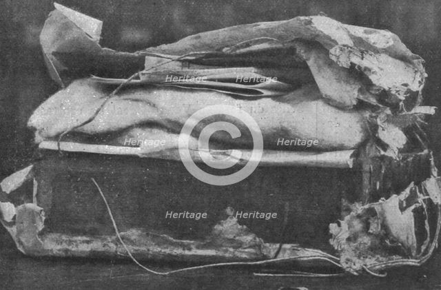 'Dans le jardin d'une legation allemande. Explosifs et cultures de microbes; la caissette..., 1916. Creator: Unknown.