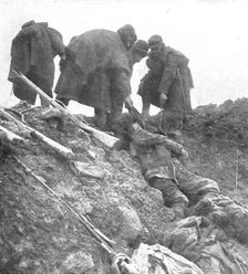 Dans les Hauts-de-Meuse; nos hommes retirent, les cadavres allemands 1915. Creator: Unknown