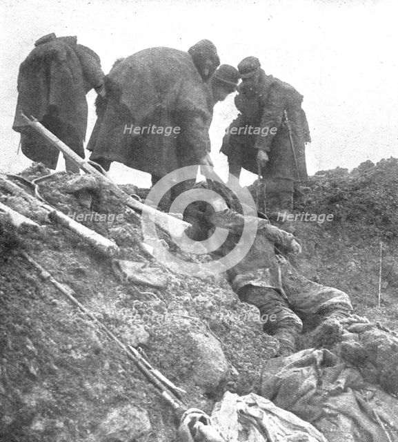 'Dans les Hauts-de-Meuse; nos hommes retirent, les cadavres allemands', 1915. Creator: Unknown.