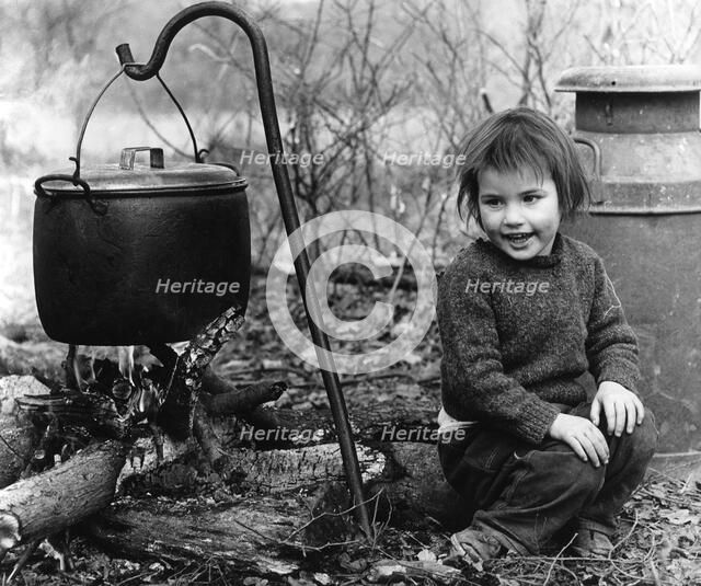 Daphne, gipsy girl, with cooking pot, Charlwood, Surrey, 1964.