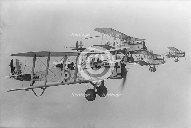 De Havilland DH9 aeroplanes flying in formation, 1923. Artist: Aerofilms.