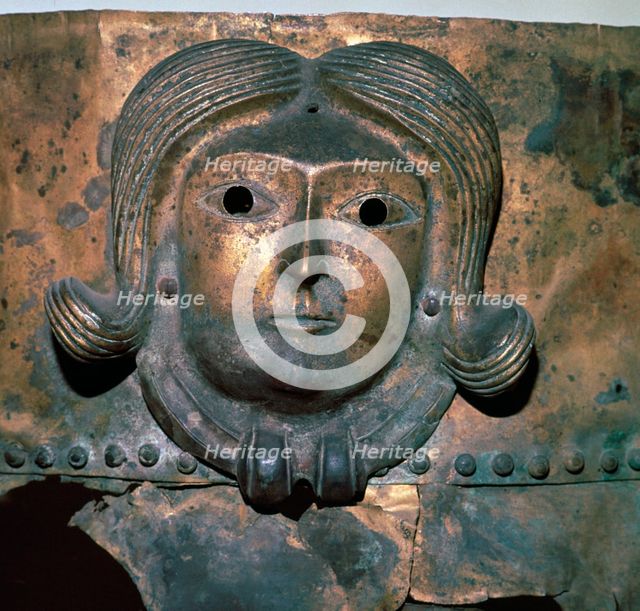 Detail of a bronze cauldron showing a human head wearing a Celtic torc, 4th century BC. Artist: Unknown