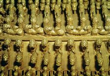 Detail of a gold pectoral with zoomorphic figures round shaped
