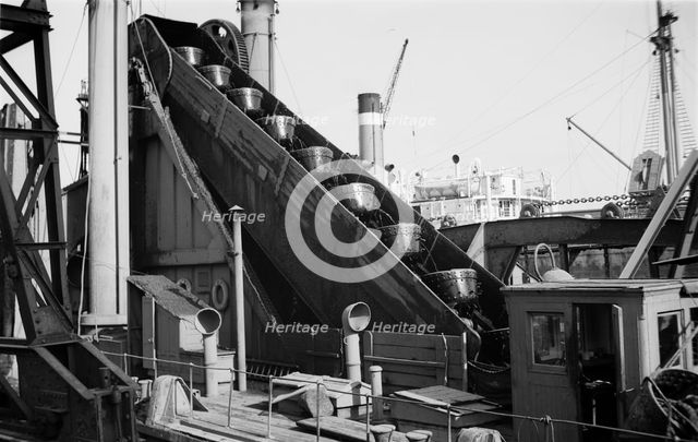 Detail of a dredger at work in Tilbury Docks, Essex, c1945-c1965. Artist: SW Rawlings