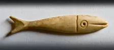 Detail of a fish-shaped bone gaming piece from Portchester Castle, Fareham, Hampshire, 2009. Creator: Derek Kendall
