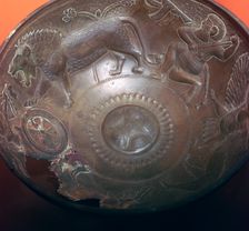 Detail of a lion-hunt on the inside of a bronze bowl, 8th century BC
