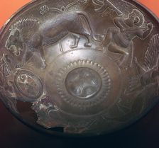Detail of a lion-hunt on the inside of a bronze bowl, 8th century BC