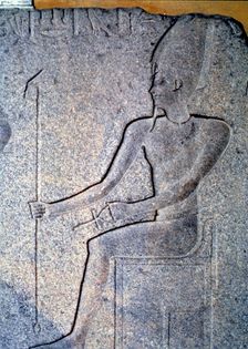 Detail of a stone engraving depicting a priest