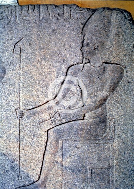 Detail of a stone engraving depicting a priest.