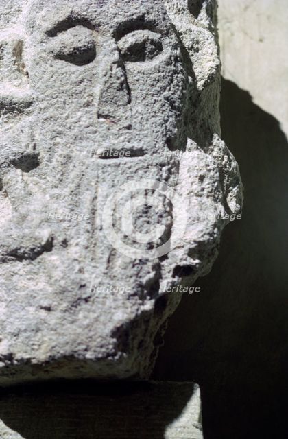 Detail of a stone head in Penmon Priory. Artist: Unknown