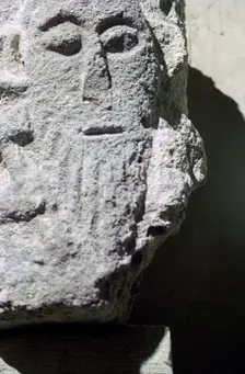 Detail of a stone head in Penmon Priory