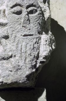 Detail of a stone head in Penmon Priory