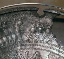 Detail of a Phoenician silver bowl showing soldiers attacking a city, 7th century BC