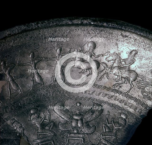Detail of a Phoenician silver bowl showing soldiers attacking a city, 7th century BC. Artist: Unknown