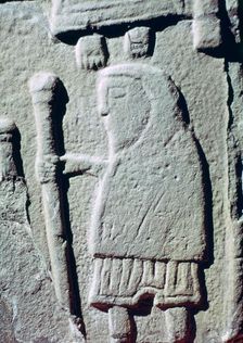 Detail of a Pictish Stone with a man wearing trousers, 11th century