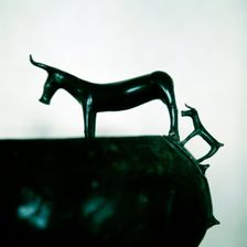 Detail of Celtic bronze bowl showing a cow and calf, Hallstatt, Austria, 6th century BC