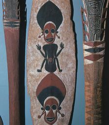 Detail of figures carved and painted on a ceremonial canoe paddle from the Solomon Islands