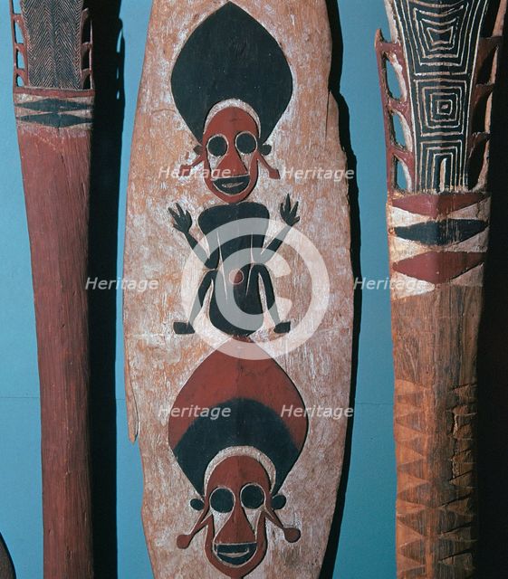 Detail of figures carved and painted on a ceremonial canoe paddle from the Solomon Islands. Artist: Unknown